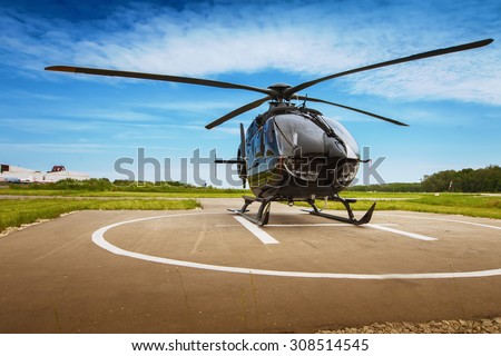 Helicopter parked at the helipad Royalty-Free Stock Photo #308514545