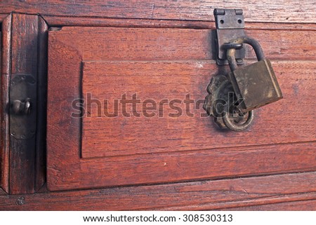 Old desk drawer lock closeup Royalty-Free Stock Photo #308530313