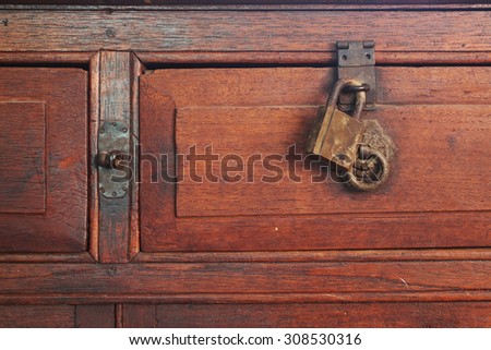 Old desk drawer lock closeup Royalty-Free Stock Photo #308530316