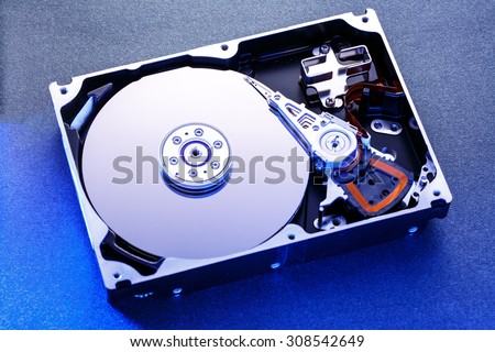 Close up of hard disk's internal mechanism hardware Royalty-Free Stock Photo #308542649