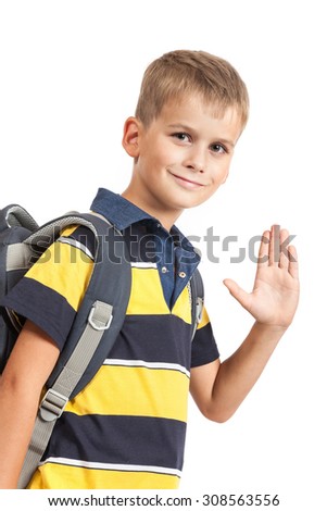 Schoolboy sitting on books isolated on a white background. Back to school