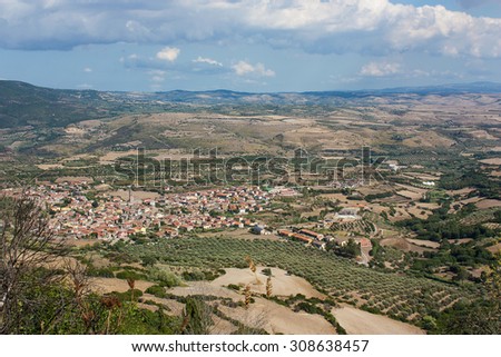 A countryside landscape with fields, hills and mountains from above in Gesturi, Sardinia. Closed to Giara di Gesturi. On the picture is seen Gesturi village.