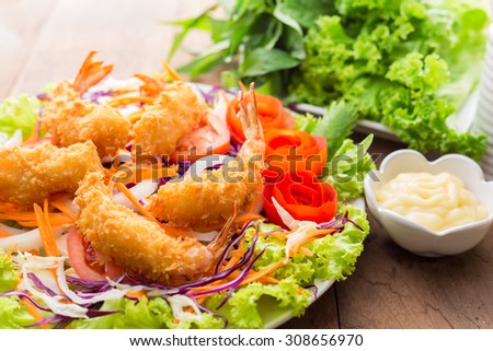 Fried Shrimp with vegetable salad - soft focus Royalty-Free Stock Photo #308656970