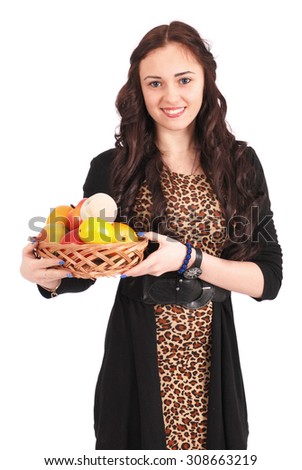 Young girl with a fruit basket isolated on white