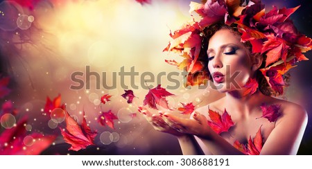 Autumn woman blowing red leaves - Beauty Fashion Model Girl
