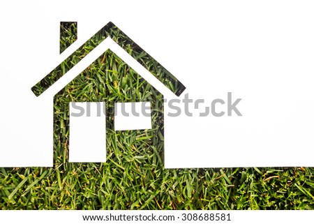 Paper house against green background. Real Estate Concept