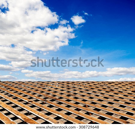 wooden floor blue sky with clouds