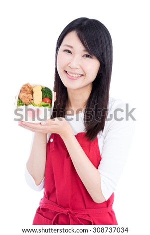 young Asian woman holding lunch box isolated on white background