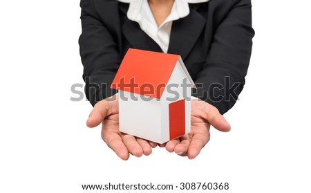 Businesswoman or estate agent and holding a model house.  isolated on white background with clipping path