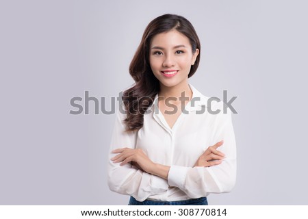 young business woman isolated on gray background Royalty-Free Stock Photo #308770814