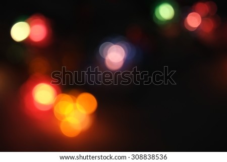 Colorful abstract background. Light of the christmas tree decoration. Make picture blur to get bokeh background.