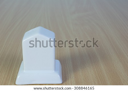 White Milepost models on the wood background