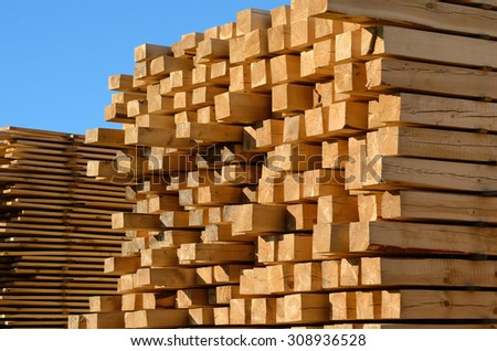 wooden boards stacked at the timber yard Royalty-Free Stock Photo #308936528