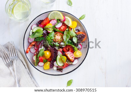Salad with fresh summer vegetables, top view Royalty-Free Stock Photo #308970515
