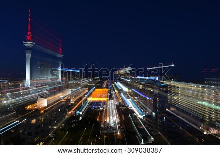 Auckland financial district center skyline at night in Auckland, New Zealand.Aerial view.Motion blur. Business and real estate concept. No people. Copy space. Royalty-Free Stock Photo #309038387