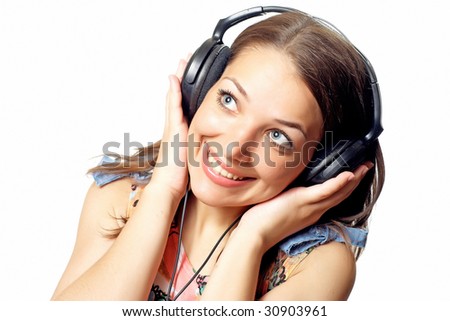 Young woman teenager listening music with headphones