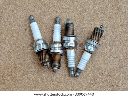 four old spark plugs