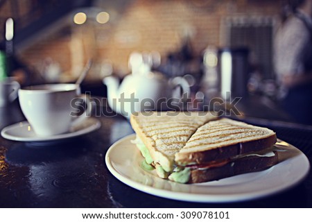 cup of tea at a cafe blurred background Royalty-Free Stock Photo #309078101