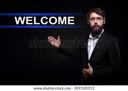 Businessman over black background presenting welcome.