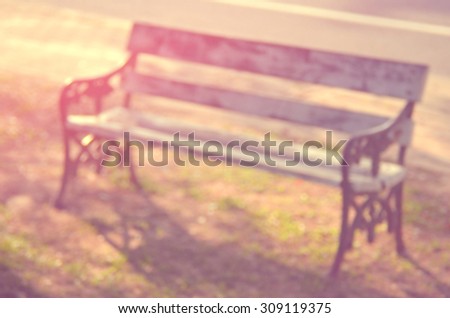 Blur outdoor chair in nature park abstract background.Retro color style.