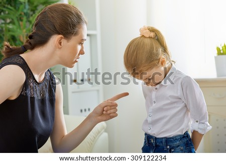 mother scolds her child Royalty-Free Stock Photo #309122234