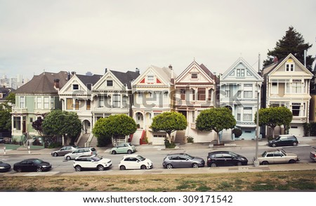 Victorian homes on Steiner Street, view from Alamo Square with the San Francisco skyline behind