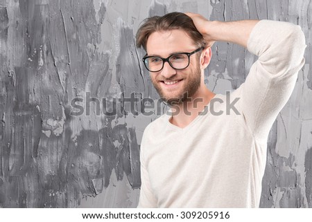 Handsome young man in glasses smiling