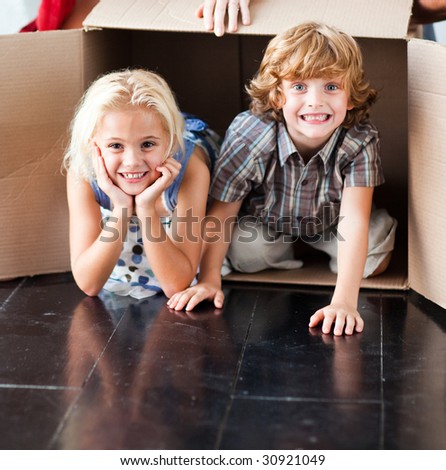 Children having fun in their new house