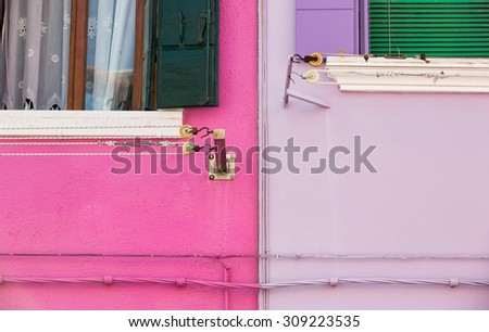 Two washing line and two electric cable with colorful wall in Burano, Venice