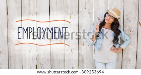The word employment against pretty brunette thinking and smiling