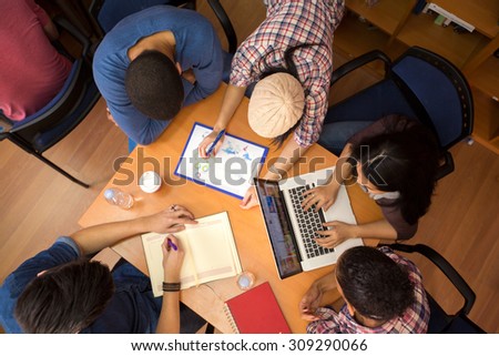 Top view of group of colleagues working  in team  Royalty-Free Stock Photo #309290066