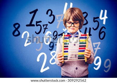 Pupil holding abacus against blue background
