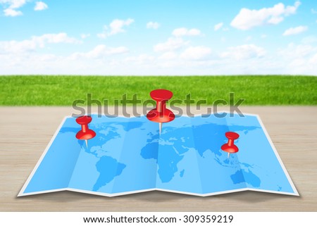 Pin map marker pointer icon on a blue world map