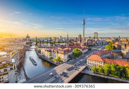 Aerial view of Berlin skyline with famous TV tower and Spree river in beautiful evening light at sunset, Germany Royalty-Free Stock Photo #309376361