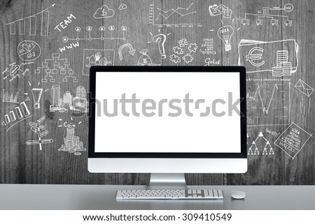 Computer and drawings in the background