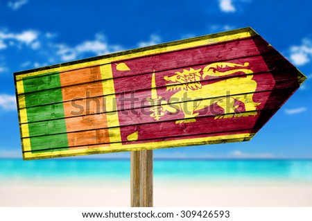 Sri Lanka Flag wooden sign on beach background
