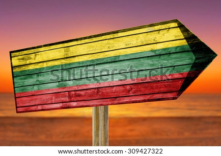 Lithuania Flag wooden sign on beach background