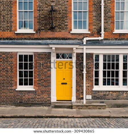 Yellow door in London. Filtered image.