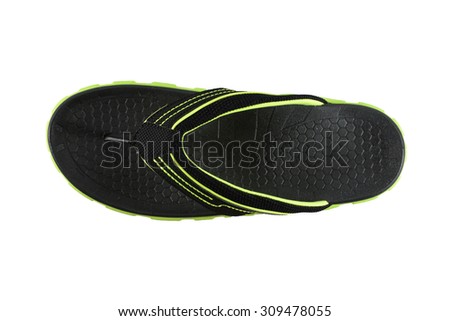 black and green flip flops on a white background