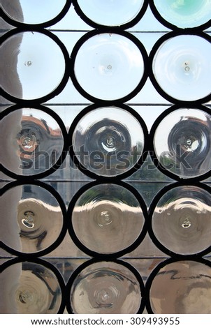 Glass wall with round frames.
