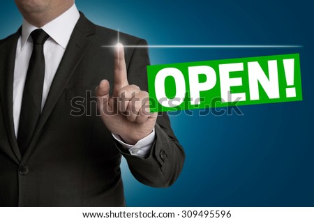 Open touchscreen is operated by businessman concept.