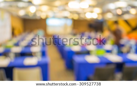 Blurred image of large seminar room for background usage .