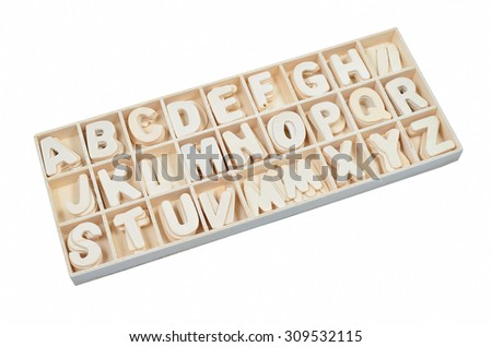 English alphabet set in wooden box isolated on white background