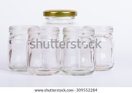 Multipurpose empty mason jar over white background