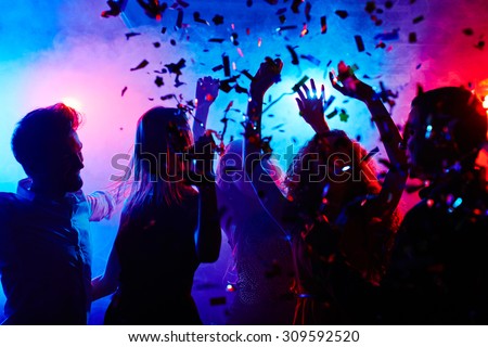 Dancing people at nightclub on Halloween night Royalty-Free Stock Photo #309592520