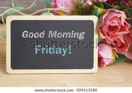 Good Morning Friday word on chalkboard with roses bouquet