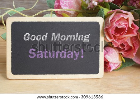 Good Morning Saturday word on chalkboard with roses bouquet