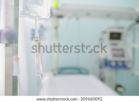 Iv drip on the background of blurred ward. Concept of serenity in hospital