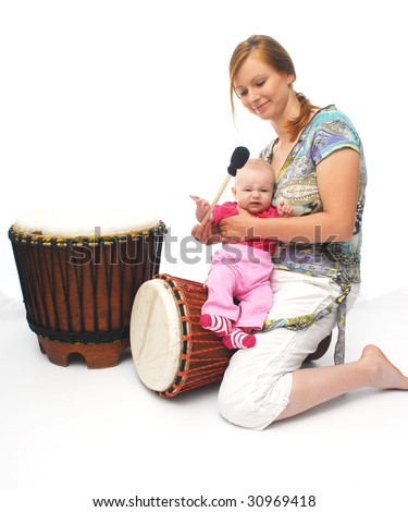 picture of happy mother with baby with drum over white