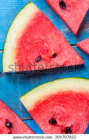 Fresh Water melon slice on Blue wood floor,  Top view